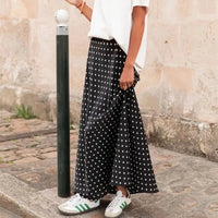 Jupe longue en satin à pois Halia