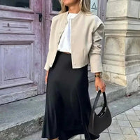 Jupe midi noire en satin taille haute Hilde